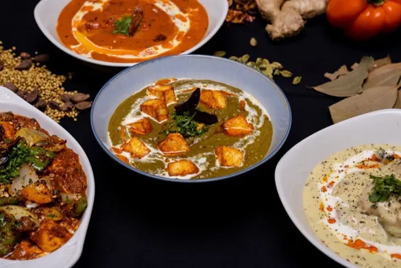 Sunny Side Up signature fusion breakfast dishes — Samosa Eggs Benny and Butter Chicken Skillet in Sherwood Park