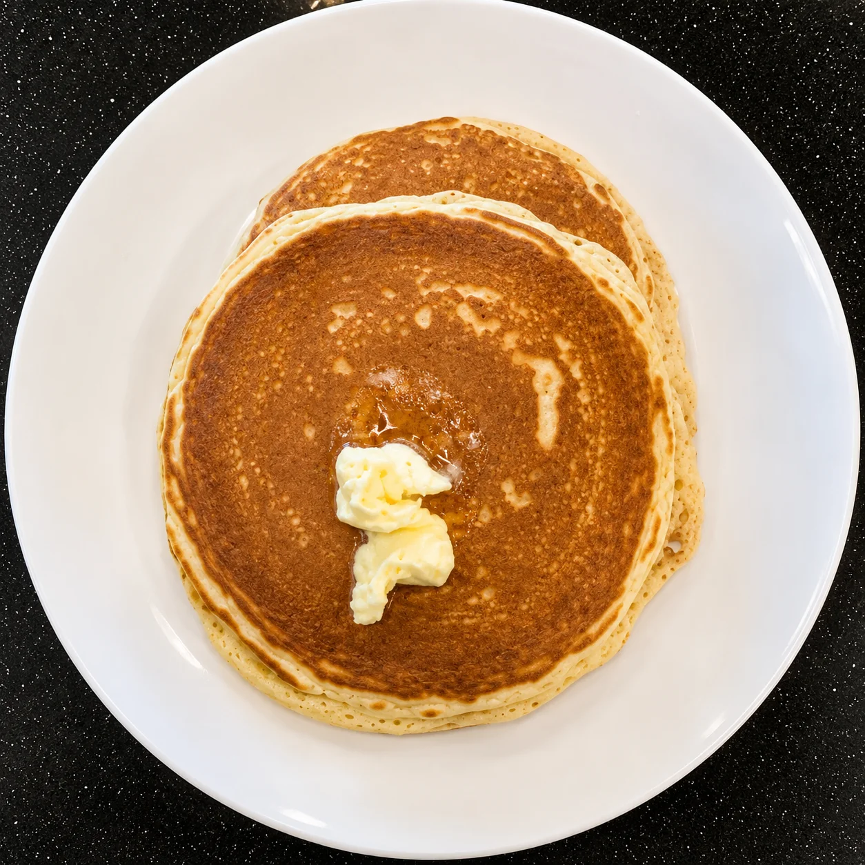 Fluffy Pancakes — buttermilk pancakes with seasonal fruit and whipped cream at Sunny Side Up Sherwood Park