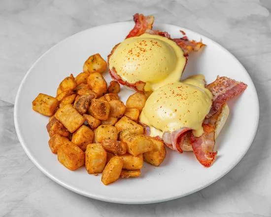 Sunny Side Benny — poached eggs with hollandaise, crispy bacon and seasoned home fries at Sunny Side Up Sherwood Park